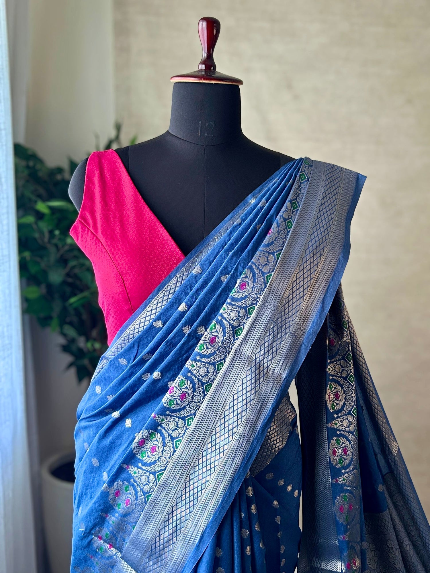 Blue Katan silk Banarasi saree with silver zari border and meenakari detailing