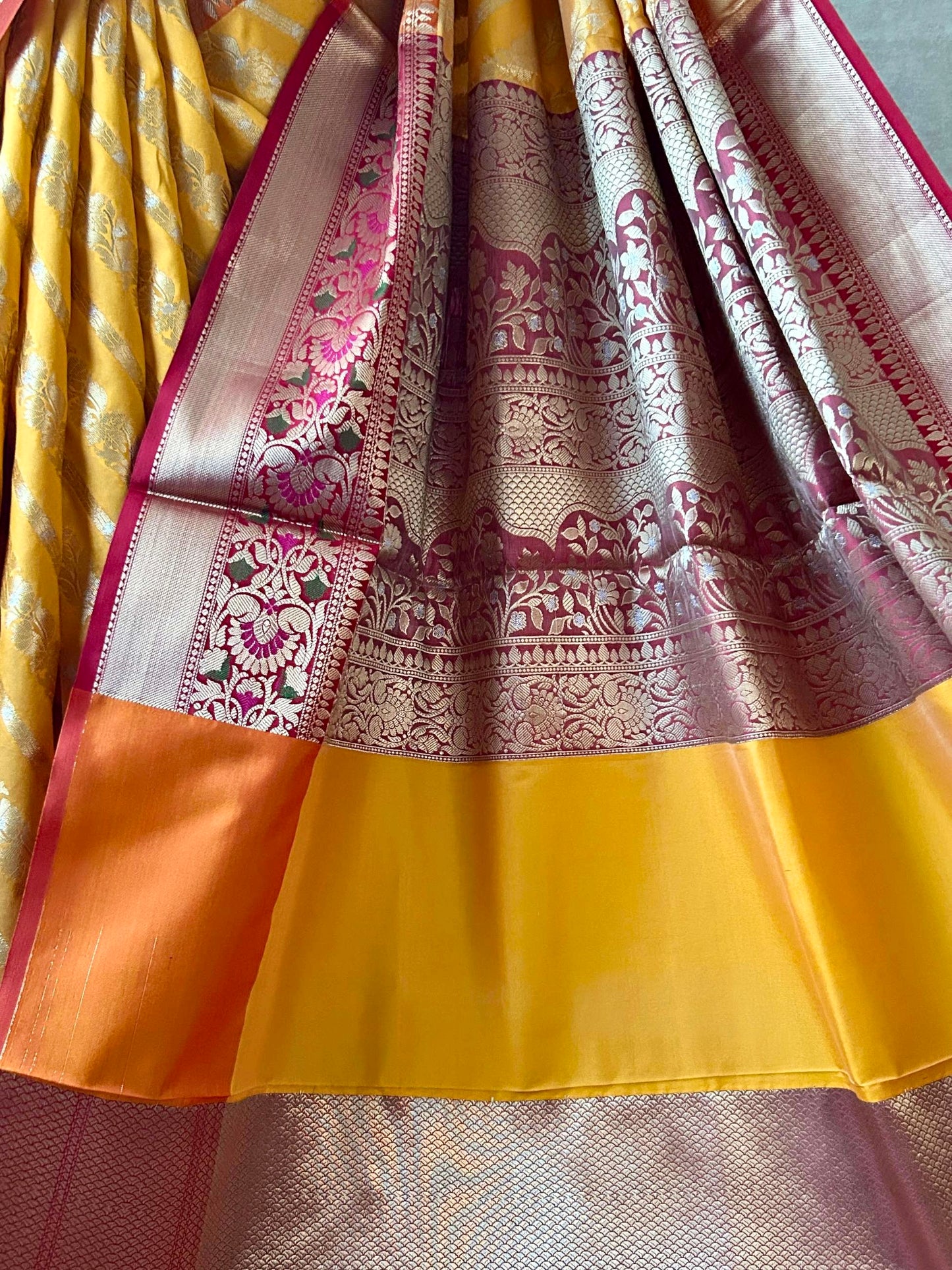 Rich woven pallu with meenakari border on Banarasi saree